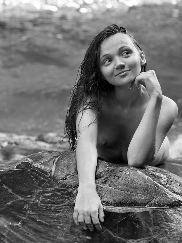 I’m only 20 years old. I’m lying completely naked on a big rock in nature. My baby boobs are beautiful in public, don’t you agree?